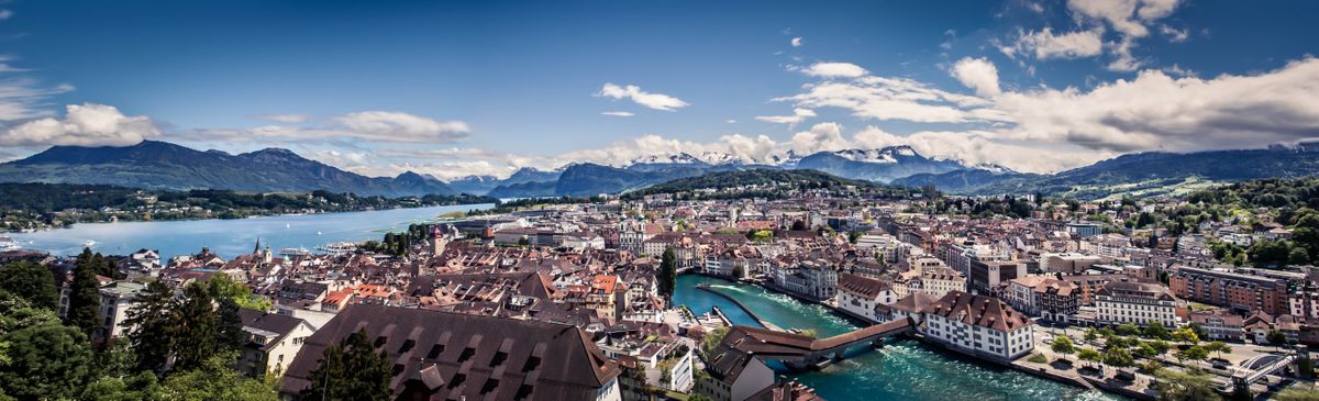 This picture was taken atop the old wall in Lucerne, Switzerland. The rain clouds had just cleared out and you could see the blue sky and white clouds coming in from the mountains. 